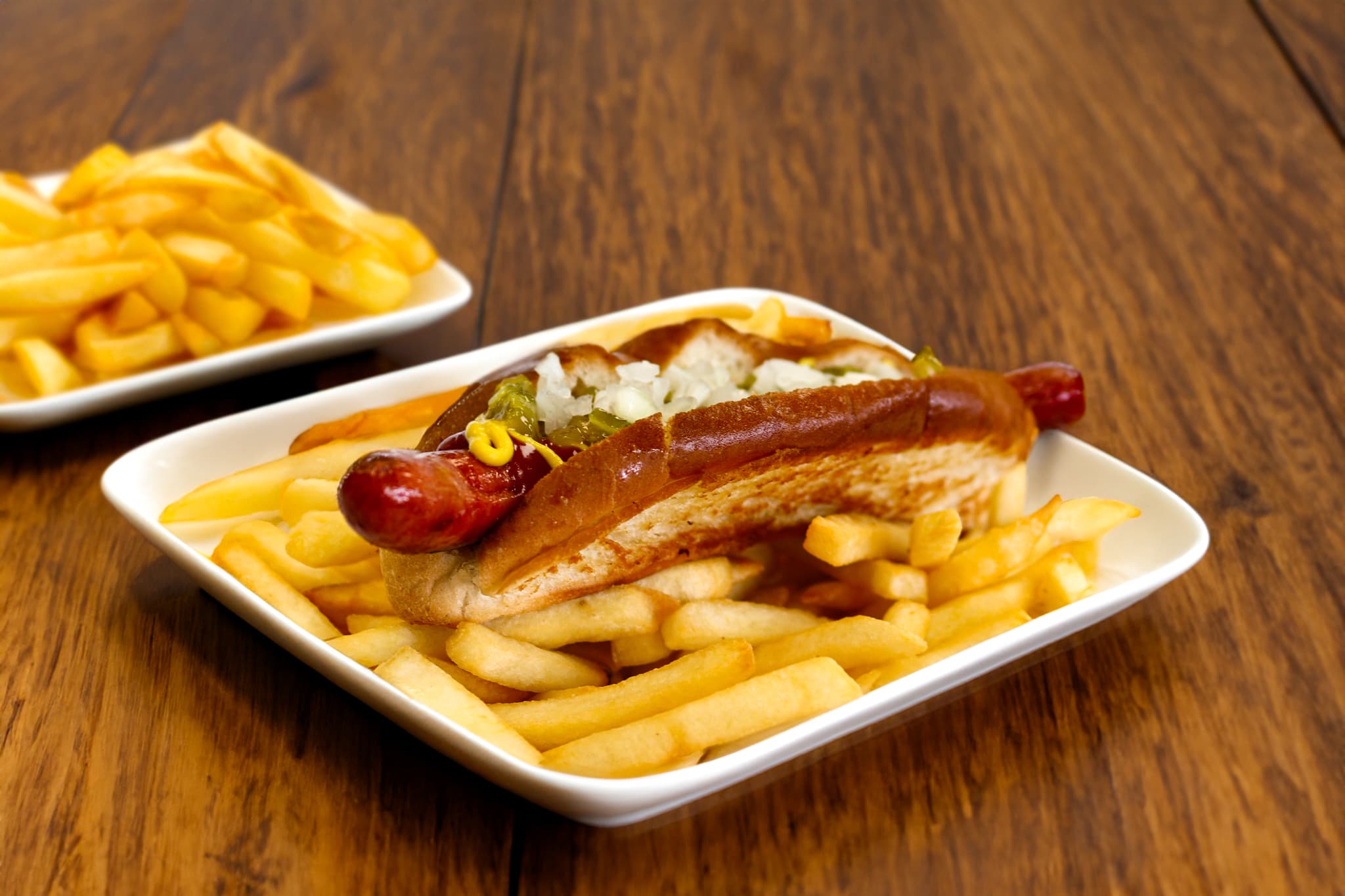 Picture of a hot dog with a side of fries